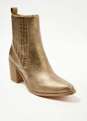 Reptile-style boots with pointed toe heels
